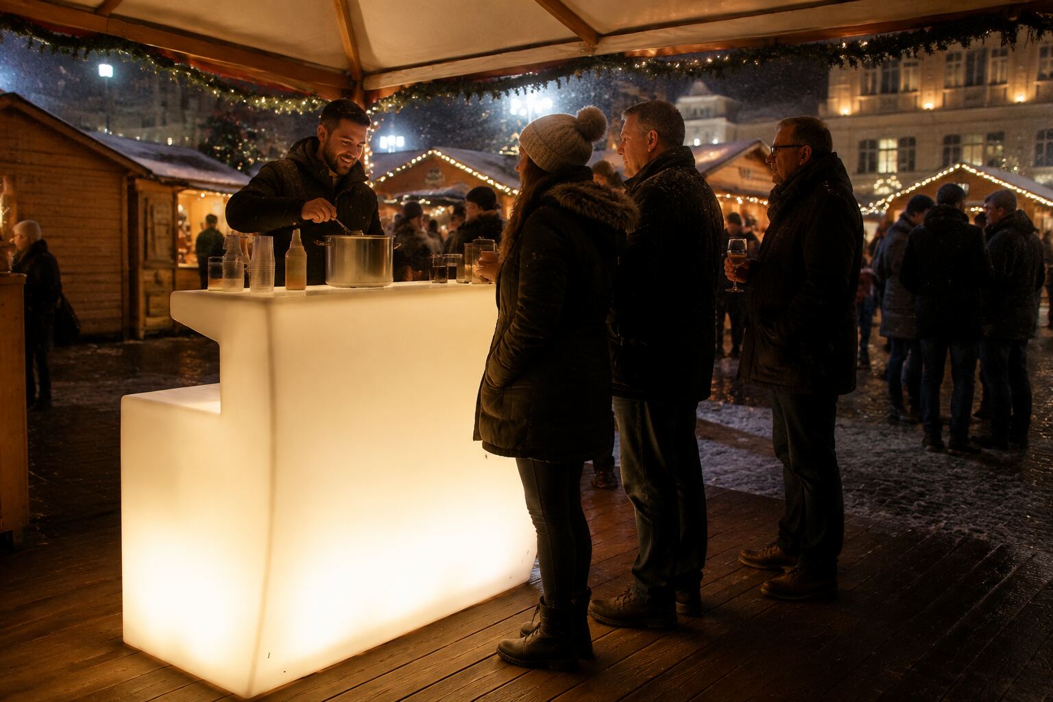 Bar lumineux blanc chaud installé sur un marché de Noël